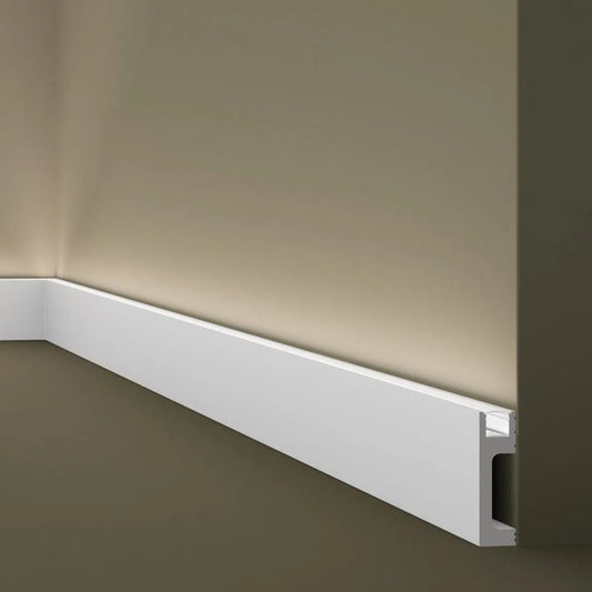 IL10 2M WALLSTYL SKIRTING BOARD WITH LED LIGHT DIFFUSER - Skirtings with cable channel owner detail on a light-colored wall | DecorMania UK