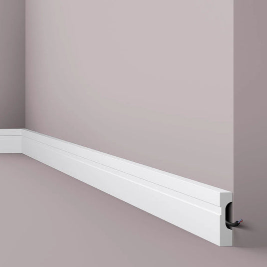 FD7 2M WALLSTYL SKIRTING BOARD - Skirtings with cable channel corner detail on a light-colored wall | DecorMania UK