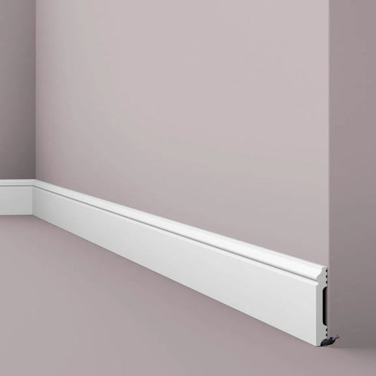 FL1 2.44M WALLSTYL SKIRTING BOARD - Skirtings with cable channel owner detail on a light-colored wall | DecorMania UK