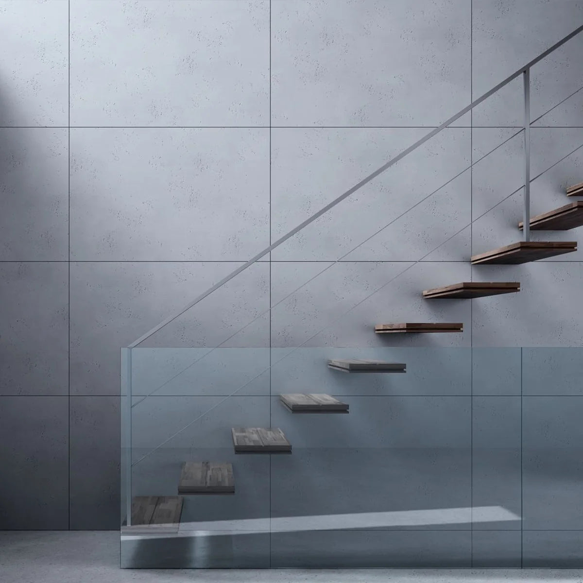 Grey concrete wall panels beside an open staircase with a glass balustrade.