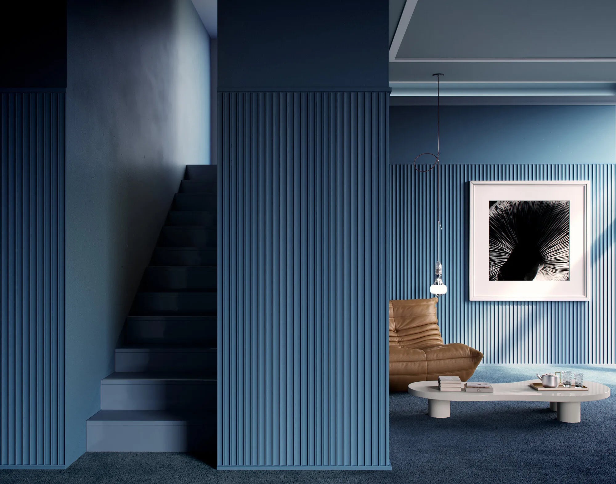 Blue DORIQUE fluted wall panels beside a staircase and adjoining seating area.