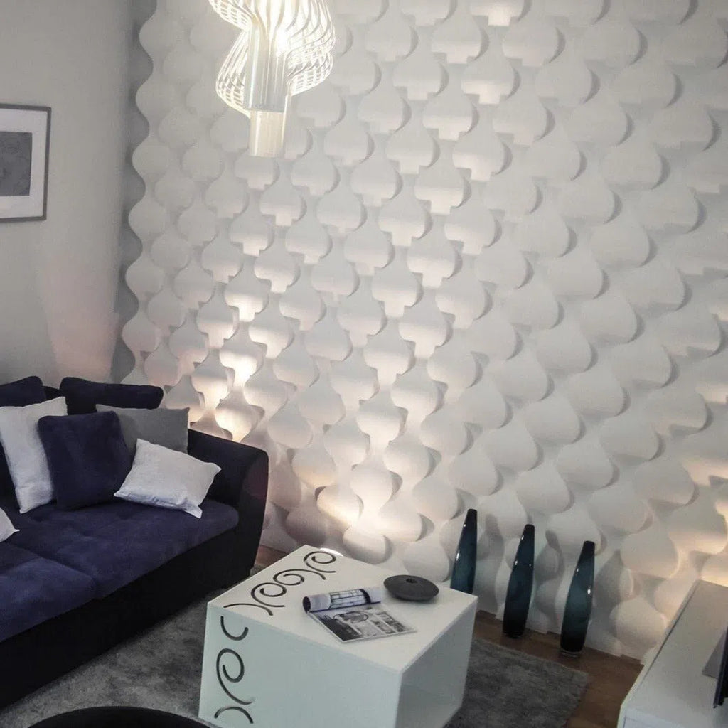3D Wall Panel - RAINDROP -  Gypsum panels with a unique droplet-shaped pattern used as a feature wall in a modern living room with accent lighting | DecorMania UK