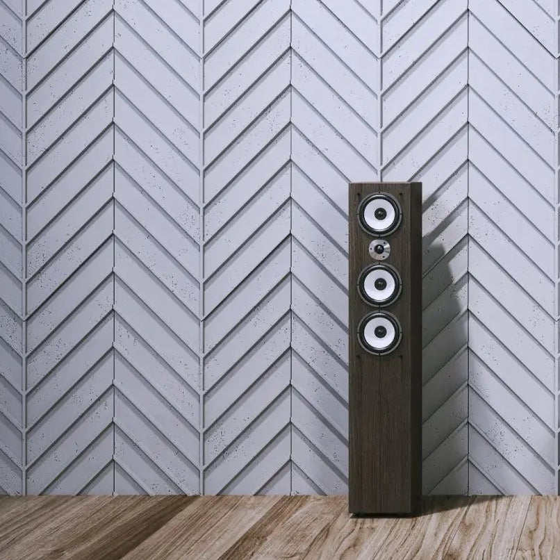 Concrete Cladding HERRINGBONE L REVERS Wall Panels in living room interior with speaker cropped DecorMania UK