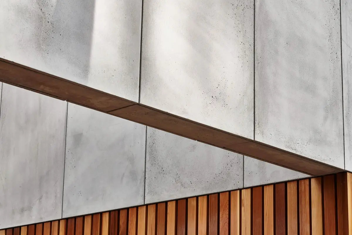 Architectural GRC concrete wall panels are used for the exterior cladding, complemented with a wooden base  | DecorMania UK
