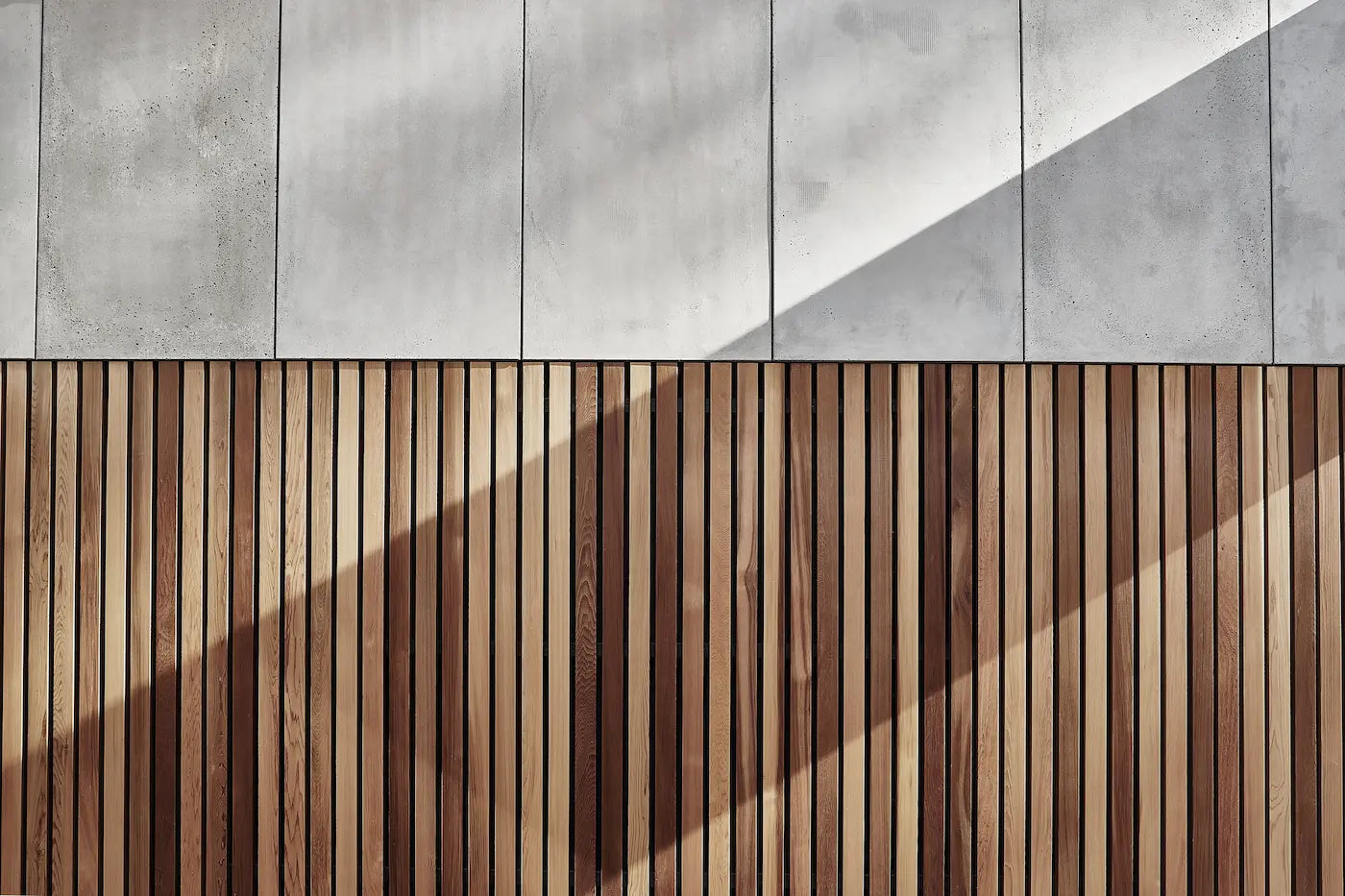 Architectural GRC concrete wall panels are used for the exterior cladding, complemented with a wooden base  | DecorMania UK