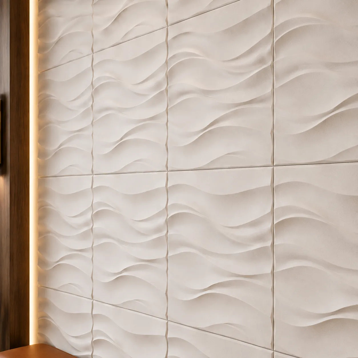 Close-up of white Desert Sand gypsum 3D wall panels showing the flowing relief and textured surface