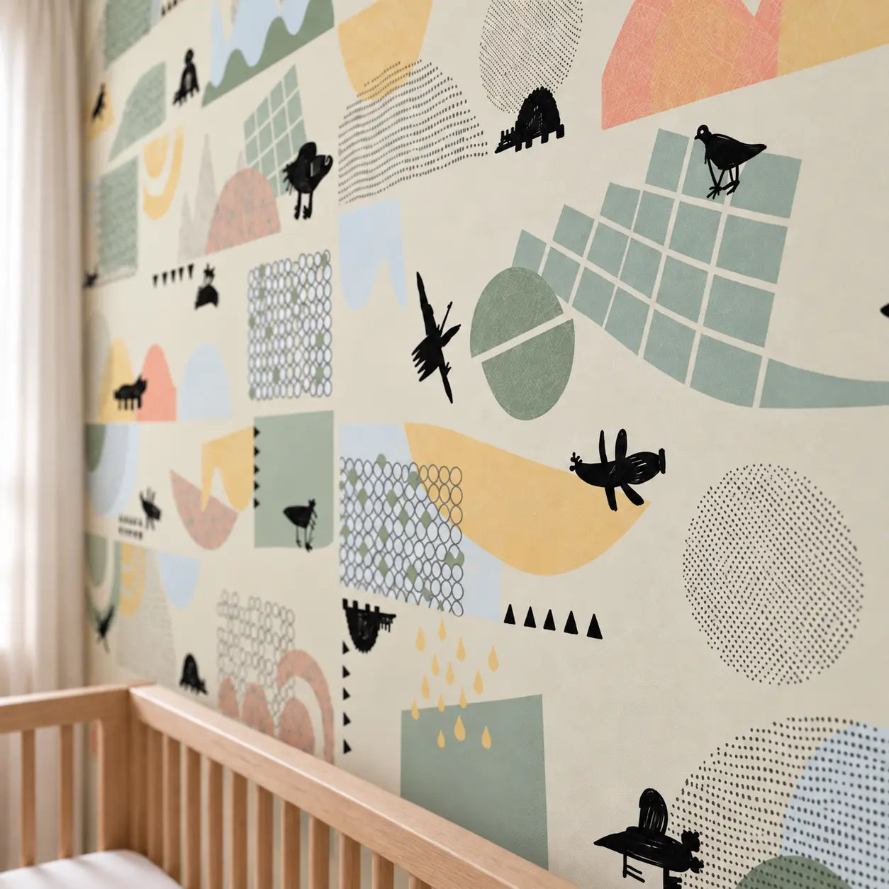 Close view of Juhu wall panels showing pastel geometric details and black animal motifs above a wooden cot