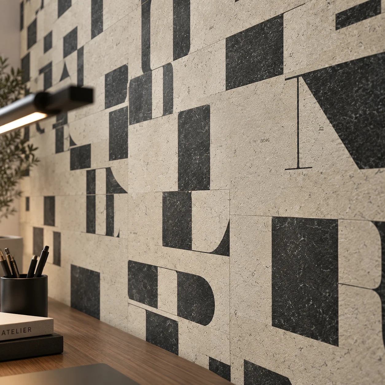 Close up of Typography mineral composite wall panels featuring abstract black letterforms and graphic details