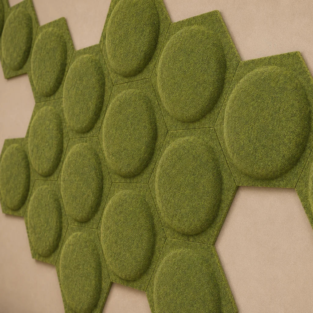 Close-up of olive hexagonal felt acoustic panels showing raised circular relief and a fibrous surface
