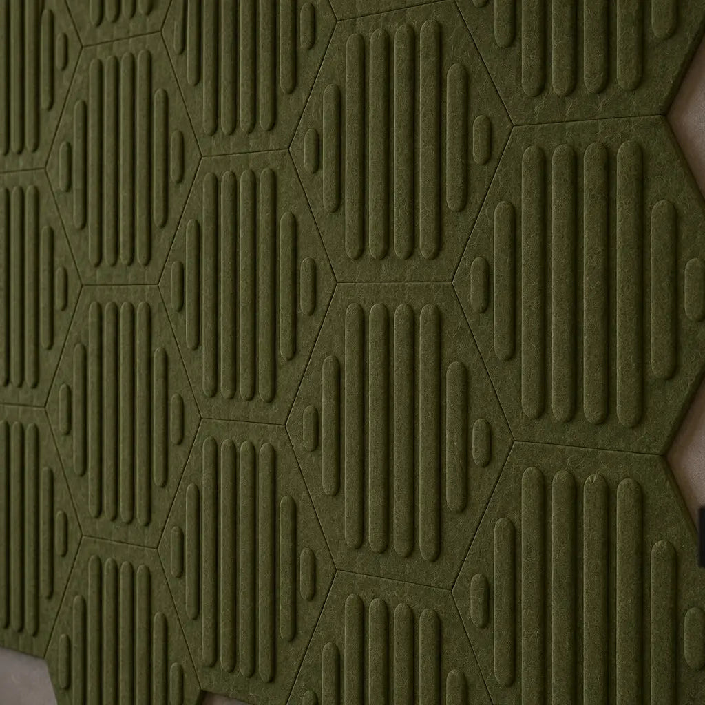 Close-up of olive HEXA RIFT 3D felt wall panels showing the raised pattern, precise joints and felt texture