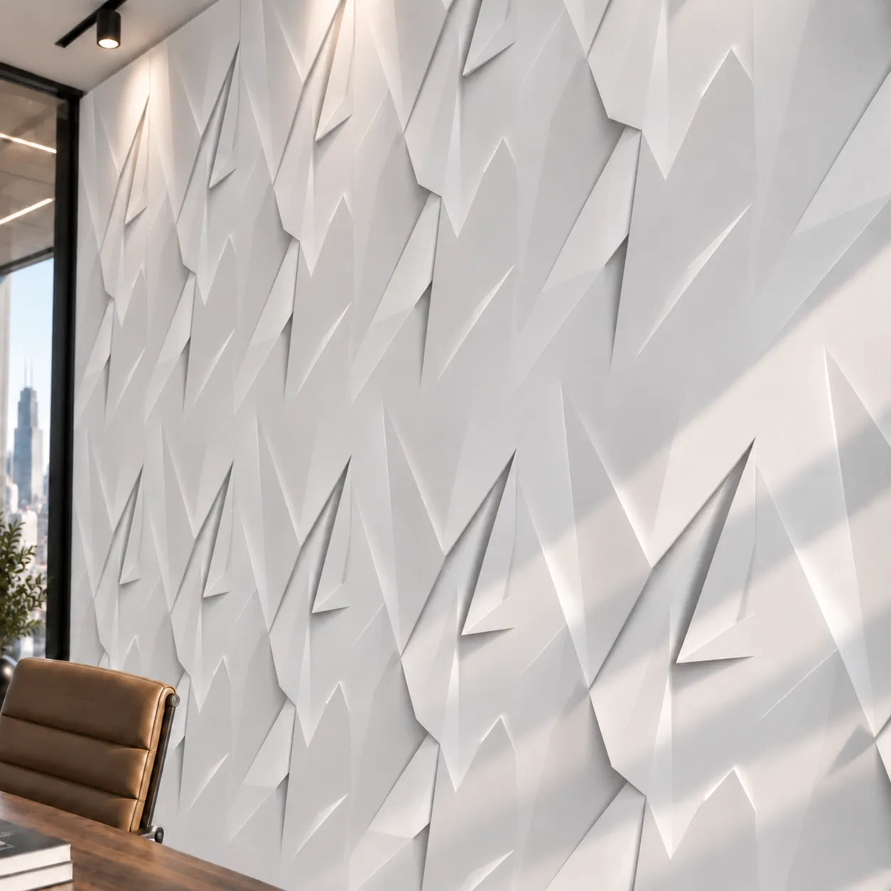 Close view of white Ice Queen 3D gypsum wall panels showing angular geometric relief and soft shadows
