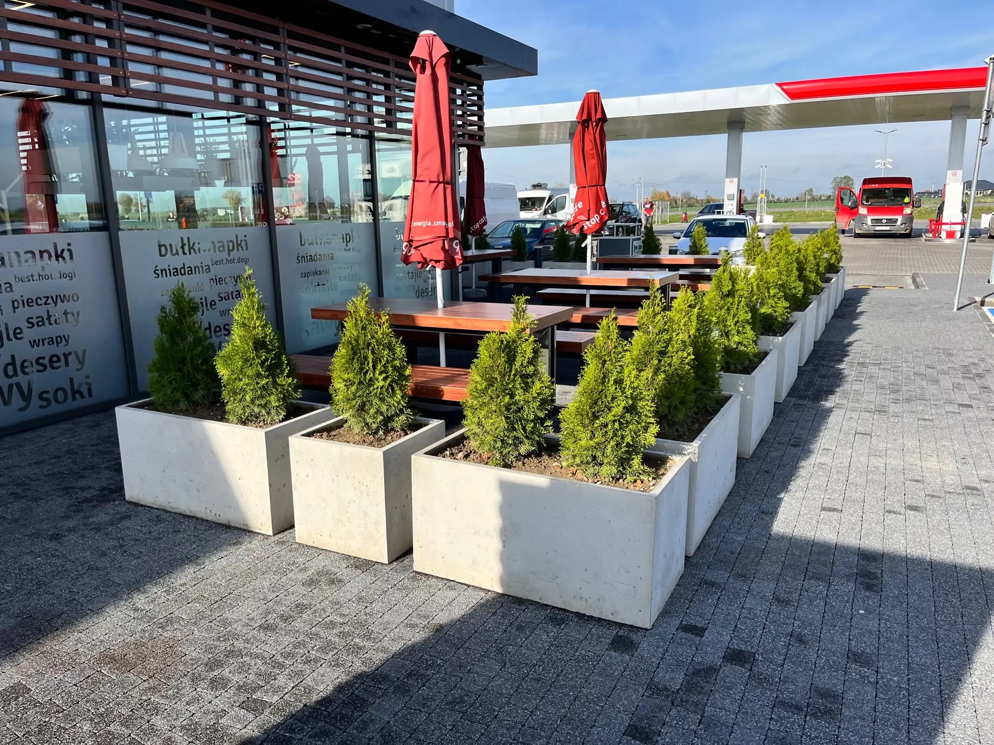 Outdoor Concrete Planters - Rectangle 50x120x50 cm in front of a gas station restaurant Decormania UK