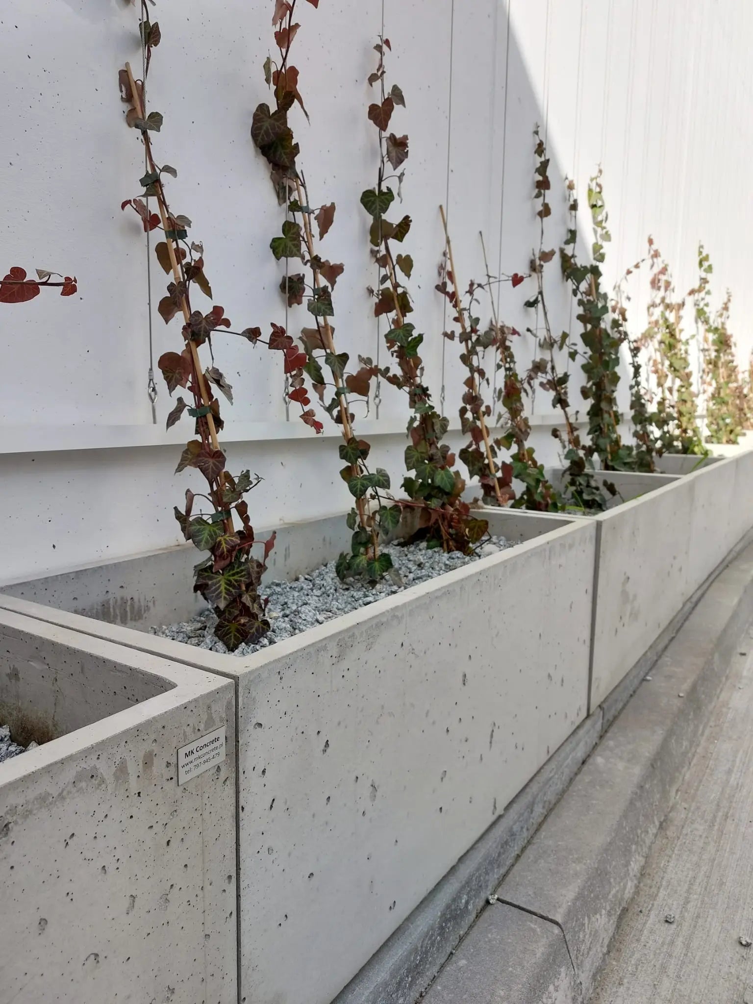 Outdoor Concrete Planters - Rectangle 50x120x50 cm in front of a building Decormania UK