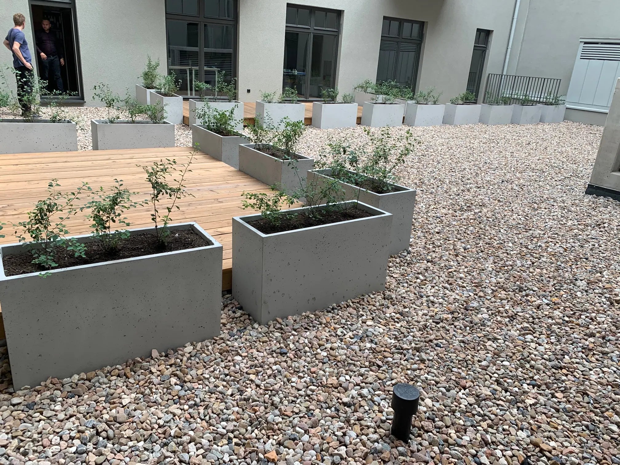 Outdoor Concrete Planters - Rectangle 50x120x50 cm in a patio outside Decormania UK