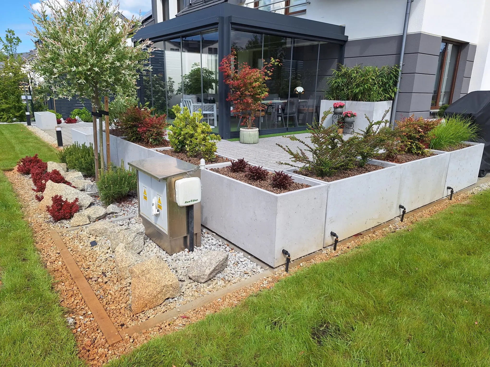Outdoor Concrete Planters - Rectangle 50x120x50 cm in a patio outside Decormania UK