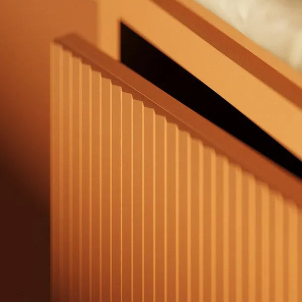 PLISSÉ L WALLSTYL decorative wall panels in a warm terracotta interior with built-in shelving