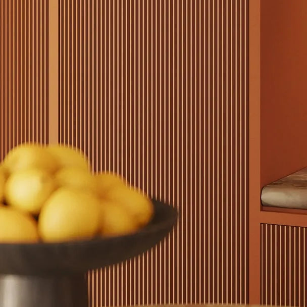 PLISSÉ L WALLSTYL terracotta wall panels used on a tall feature wall beside curtains
