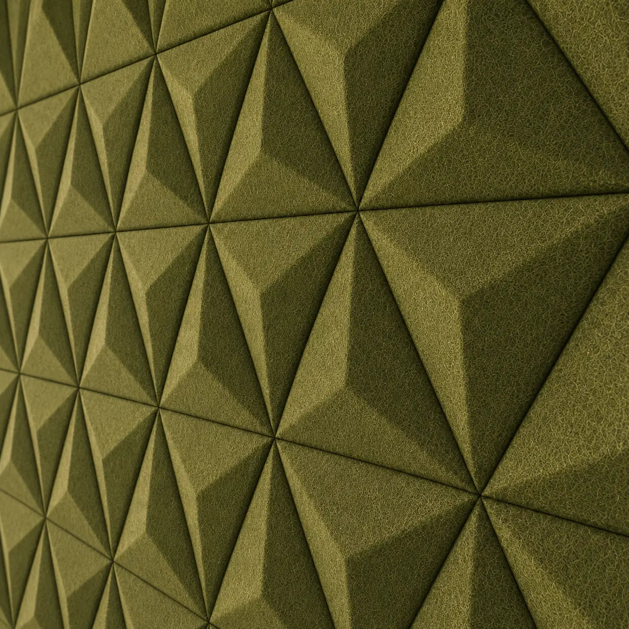 Olive PYRAMID 3D acoustic felt wall panels in a modern living room with a cream sectional sofa, wooden furniture and warm lighting close up