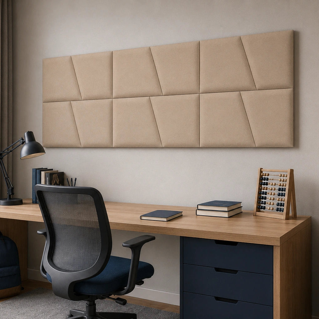 Angled view of a beige modular wall panel arranged in two rows above a home-office desk, showing its regular grid and diagonal pattern