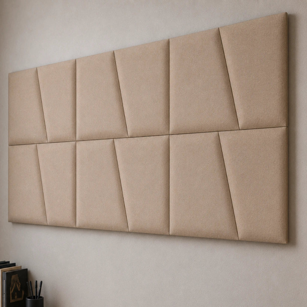 Close-up angled view of beige upholstered wall panels, highlighting the geometric seams, padded relief, precise joints and textured fabric finish