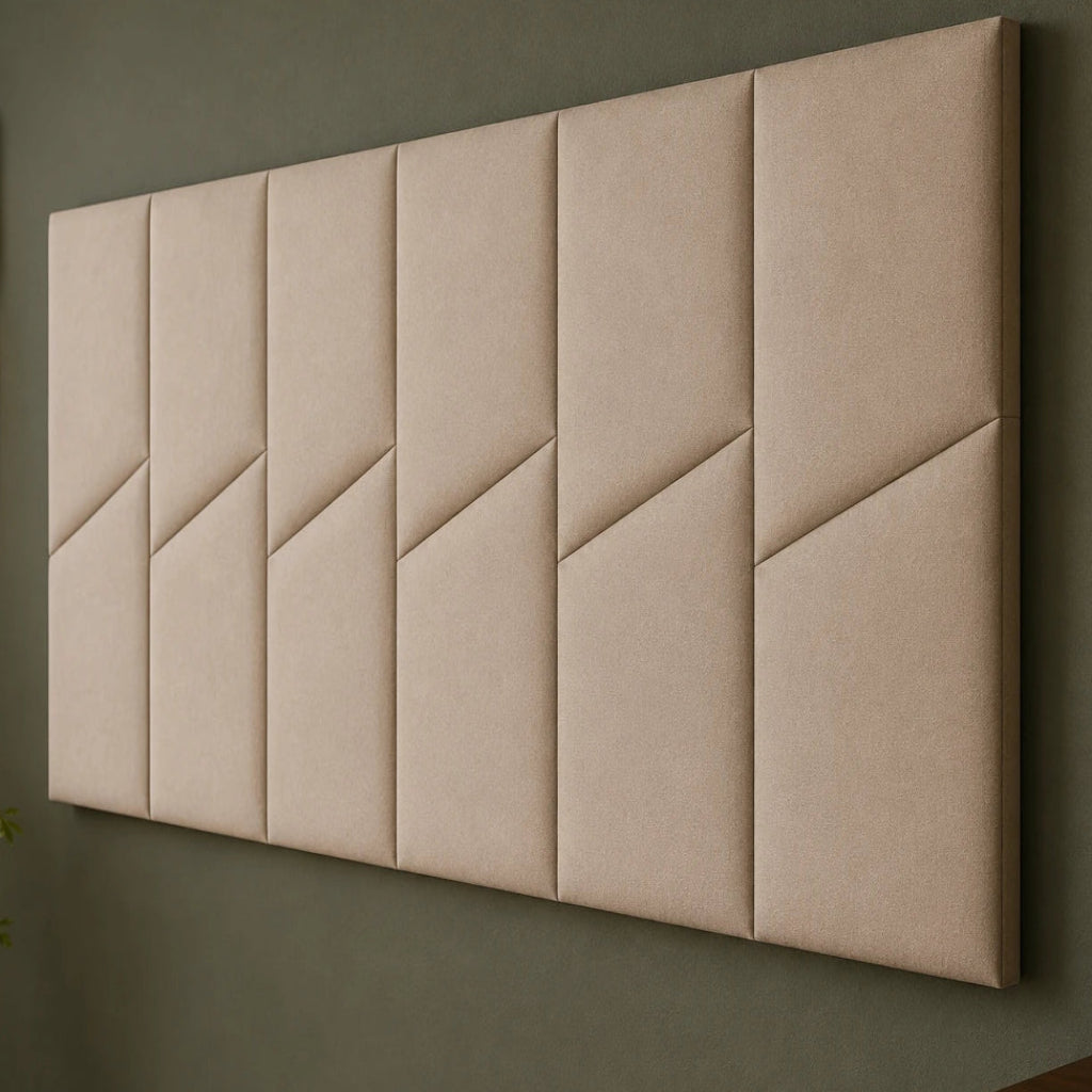 Close-up angled view of six beige padded wall panels, showing the fabric texture, diagonal seams and narrow joints