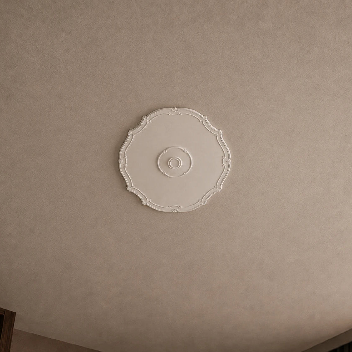 Ceiling rose on a beige ceilling