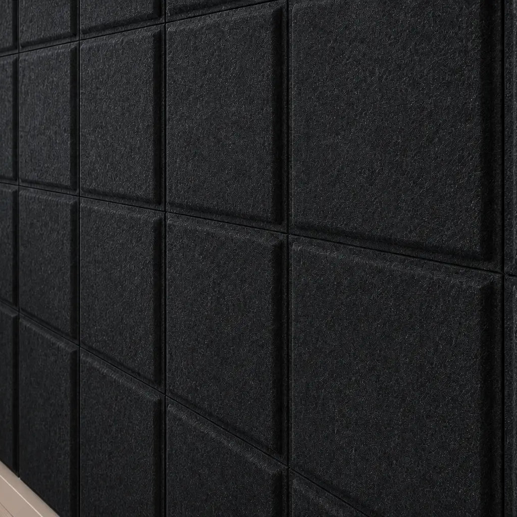 Close-up of black Square Bold 3D acoustic felt panels highlighting their fibrous texture and geometric relief