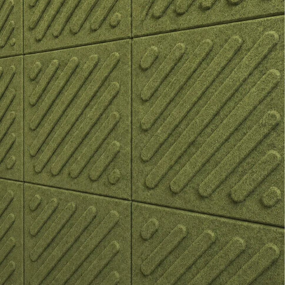 Close-up of olive green acoustic felt wall panels highlighting the fibrous texture, raised relief and module connections