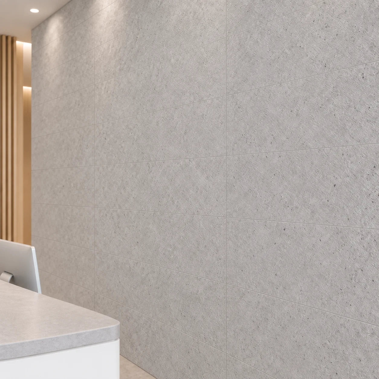 Close-up of Grey Stone wall panels showing the light grey stone texture and panel joints