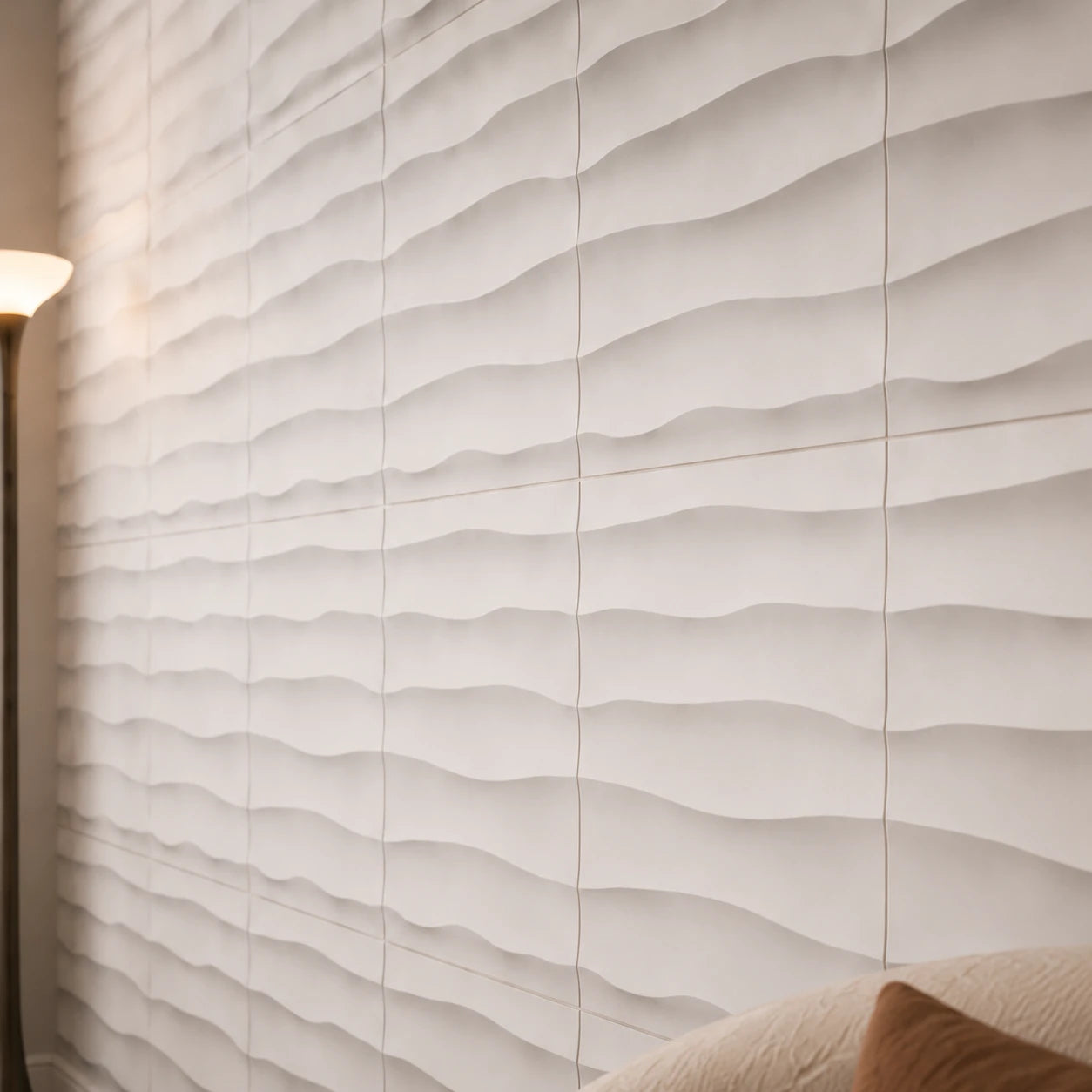 Close-up of white WAVES 3D polystyrene wall panels showing their horizontal relief, modular joints and matte texture