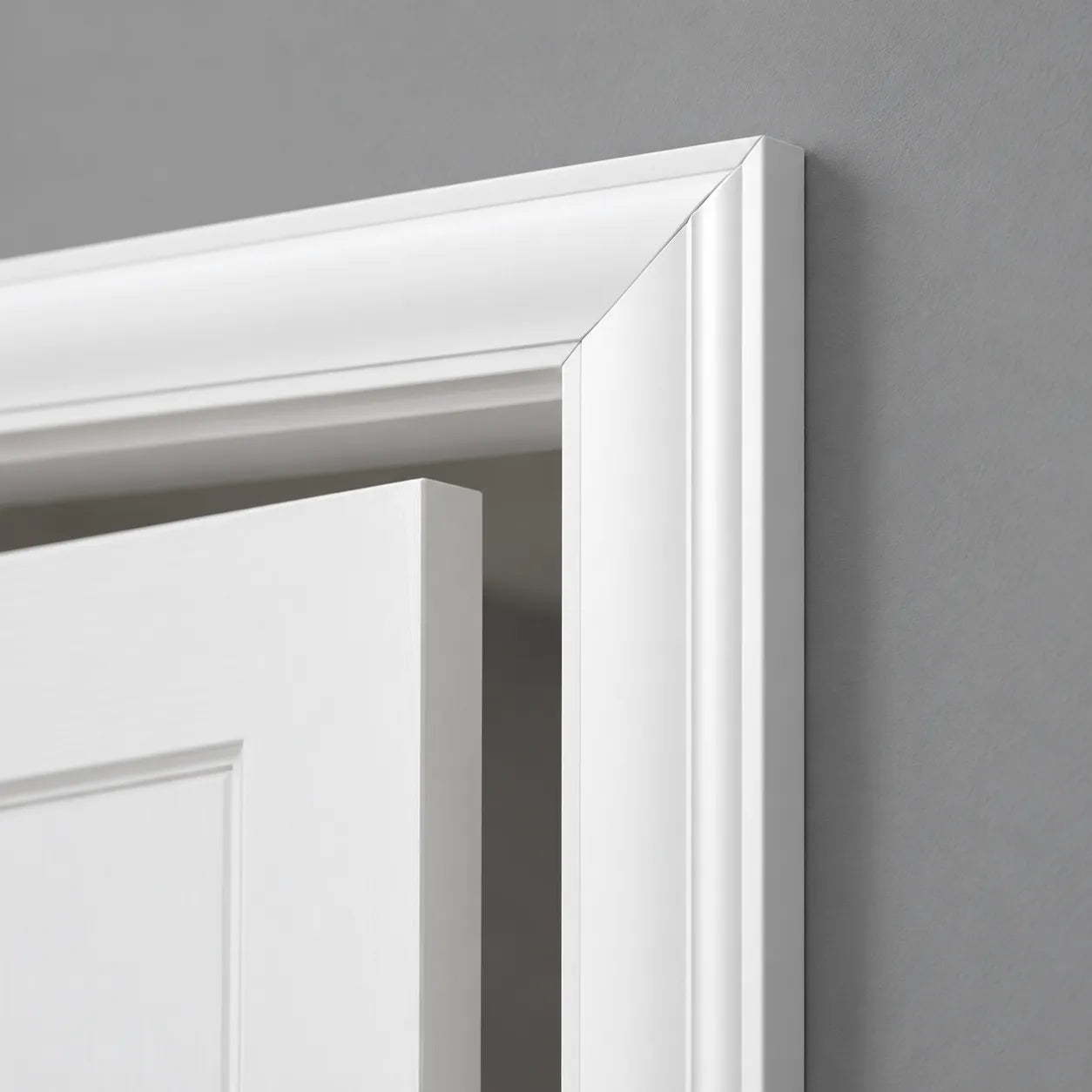 Close-up of WD2-2200 WALLSTYL white door frame with precise mitred corner detail