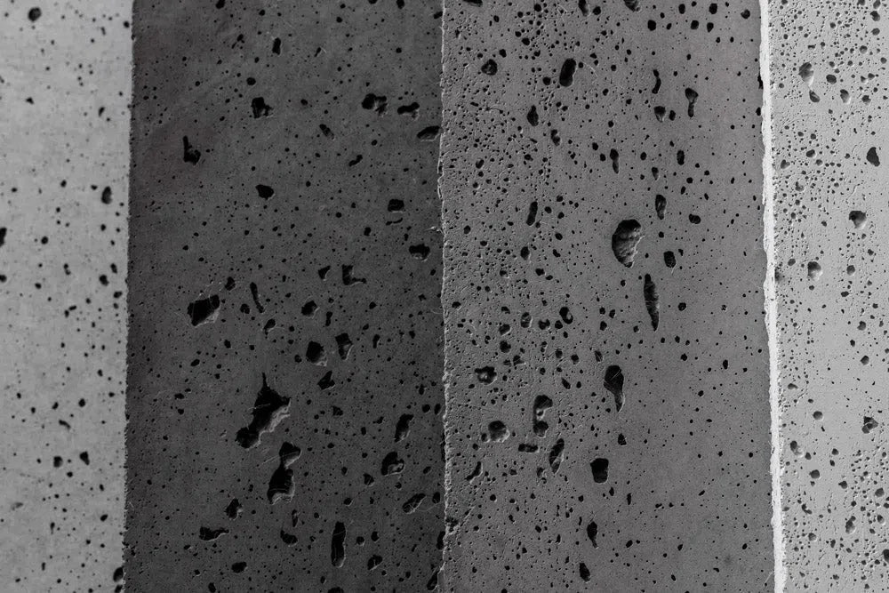 Wallset Concrete wall panels sample box - Close-up view of concrete texture in various colors  | DecorMania UK