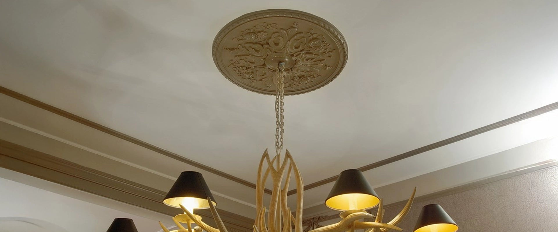 Before & After with Our ARSTYL® Ceiling Roses on grey ceiling with unique chandelier