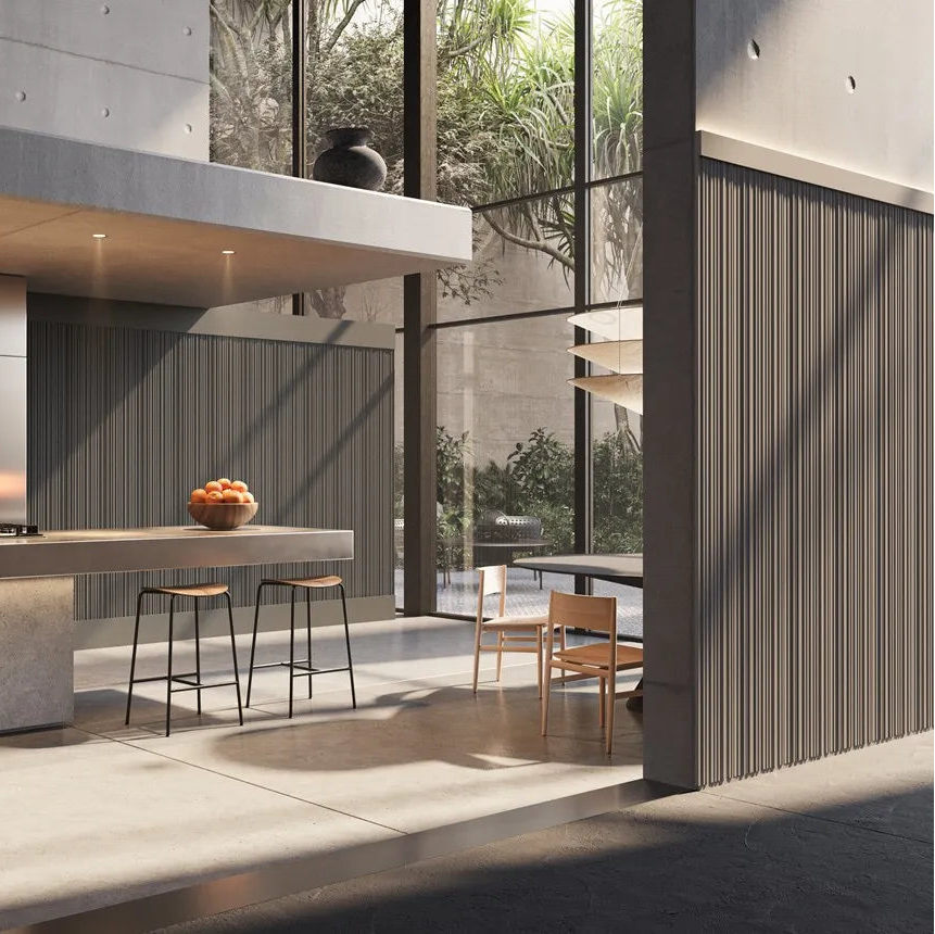 Dark ALLEGRETTO FLEX panels covering a round column and walls in a modern kitchen with floor-to-ceiling windows