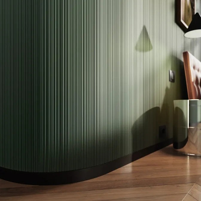 Close-up of ALLEGRETTINO FLEX ARSTYL flexible ribbed wall panels following a rounded green wall