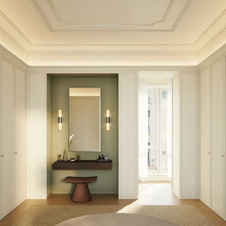 Close-up of sage green CANOPEE MIX wall panels beside a vanity mirror and illuminated wall light