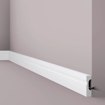 FD7 2M WALLSTYL SKIRTING BOARD - Skirtings with cable channel corner detail on a light-colored wall | DecorMania UK 