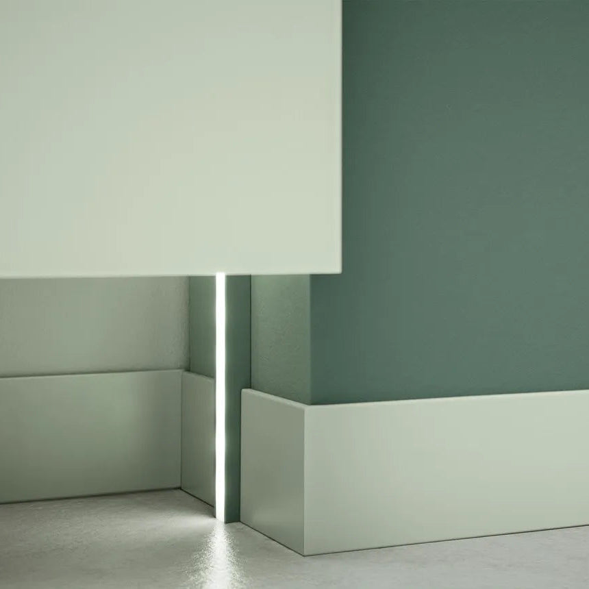 White FL9 WALLSTYL skirting board with integrated vertical LED lighting detail