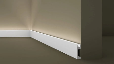IL10 2M WALLSTYL SKIRTING BOARD WITH LED LIGHT DIFFUSER - Skirtings with cable channel owner detail on a light-colored wall | DecorMania UK