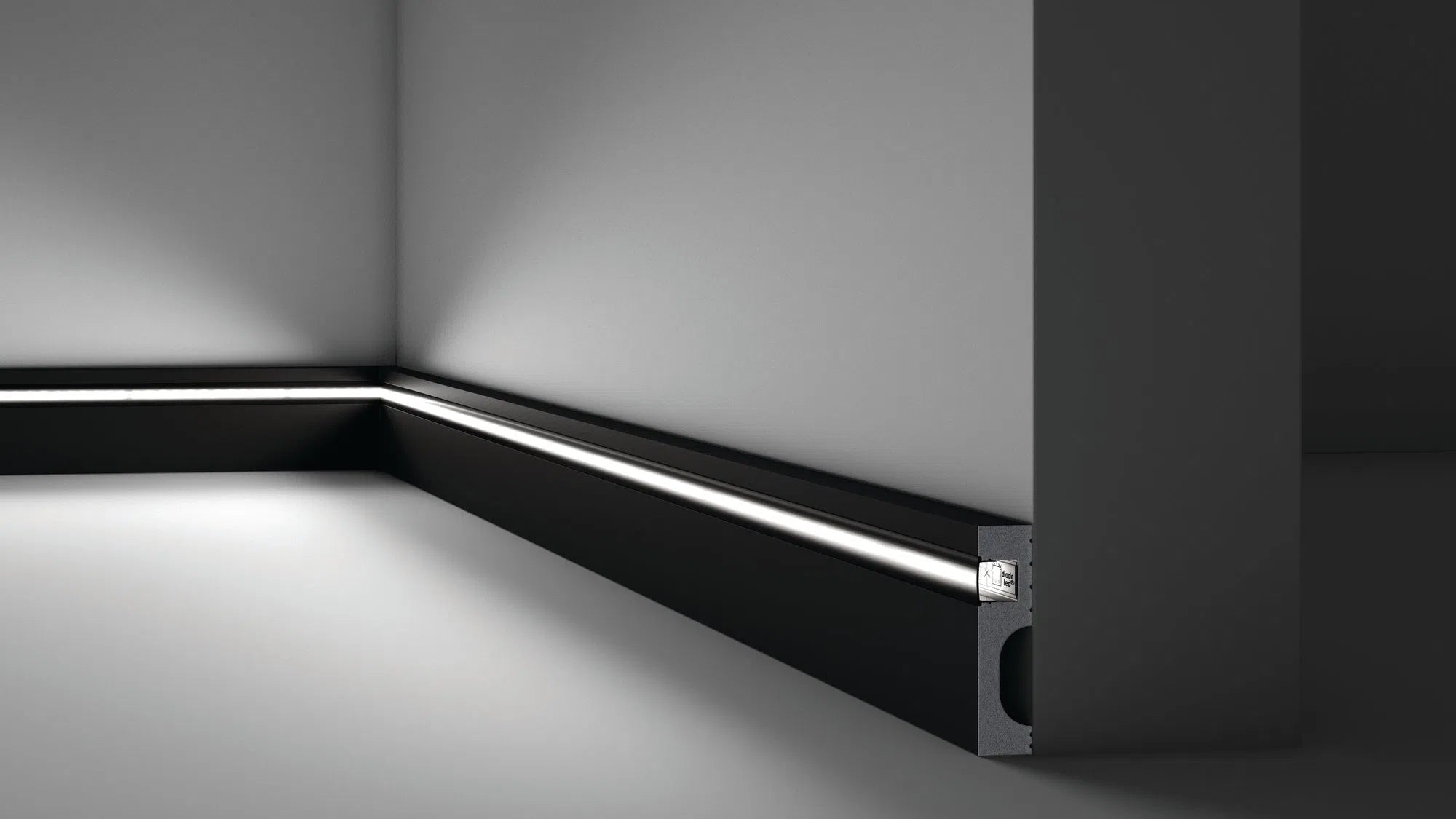 IL11 2M BLACK WALLSTYL SKIRTING BOARD - Skirtings with cable channel owner detail on a light-colored wall | DecorMania UK | DecorMania UK 