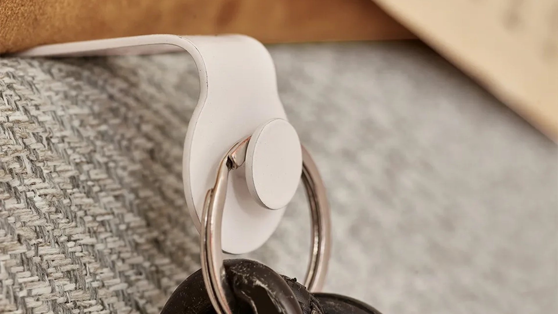 Padded Wall Boards Accessories - Elastic closeup of hook on grey panel Decormania UK