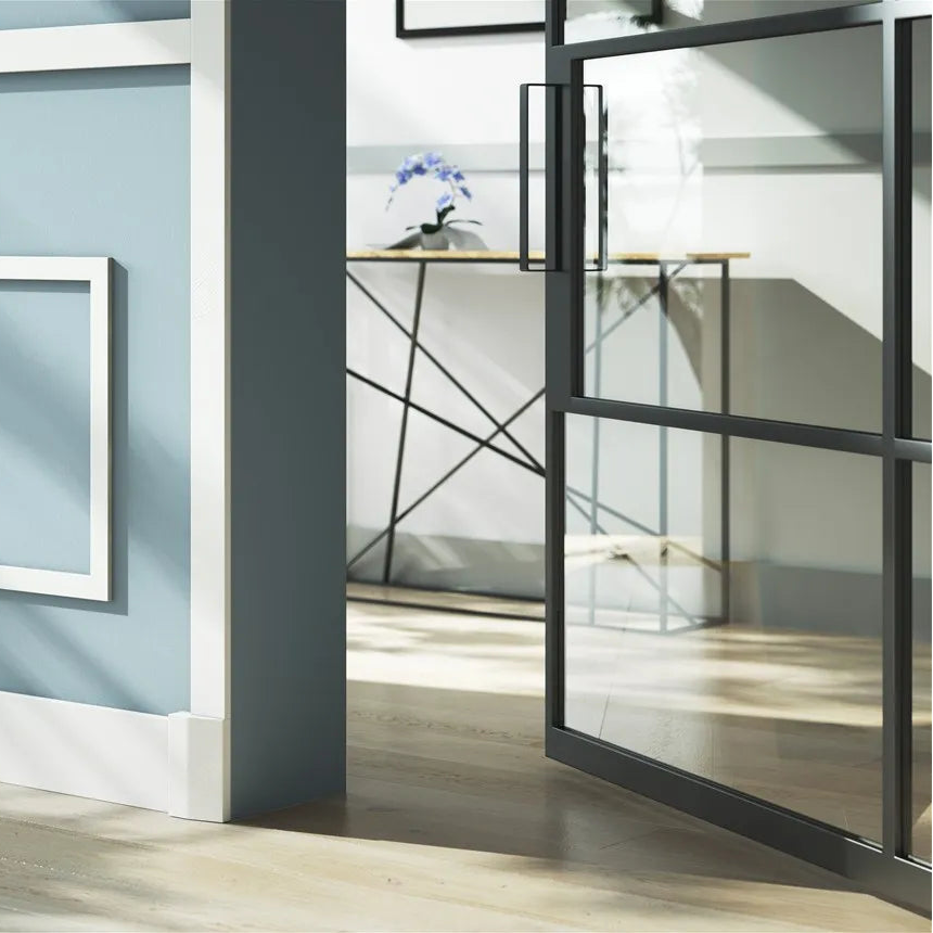 White WB2 WALLSTYL door frame base block with matching skirting and wall mouldings in a sunlit blue hallway