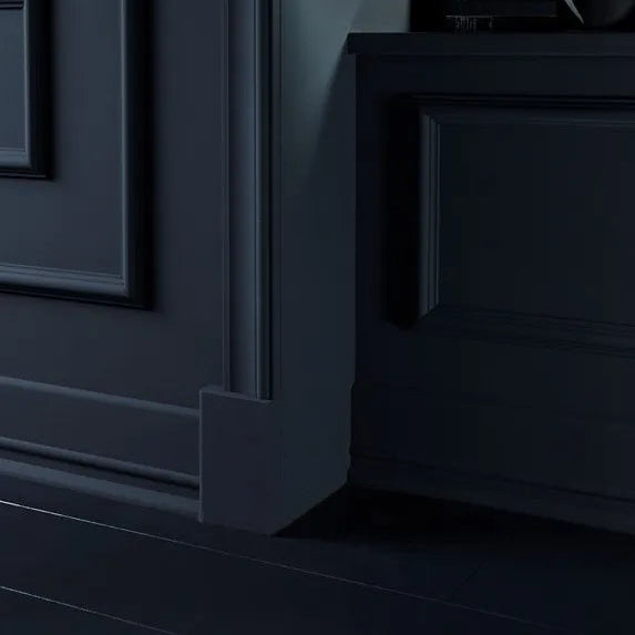 WB3 WALLSTYL plinth block integrated with dark decorative door trim and wall mouldings