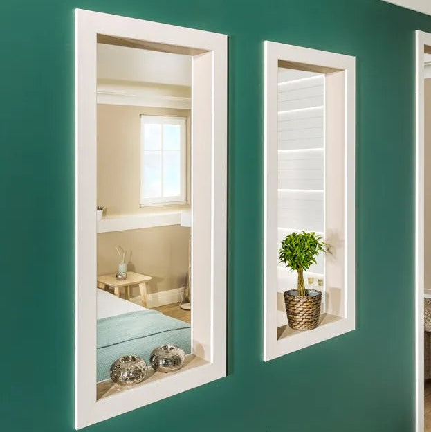 WD4 WALLSTYL white decorative mouldings used to frame mirrors on a green feature wall