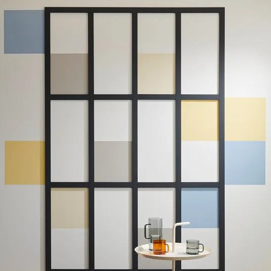 WD5 WALLSTYL black decorative mouldings forming a modern grid pattern with contrasting wall colours