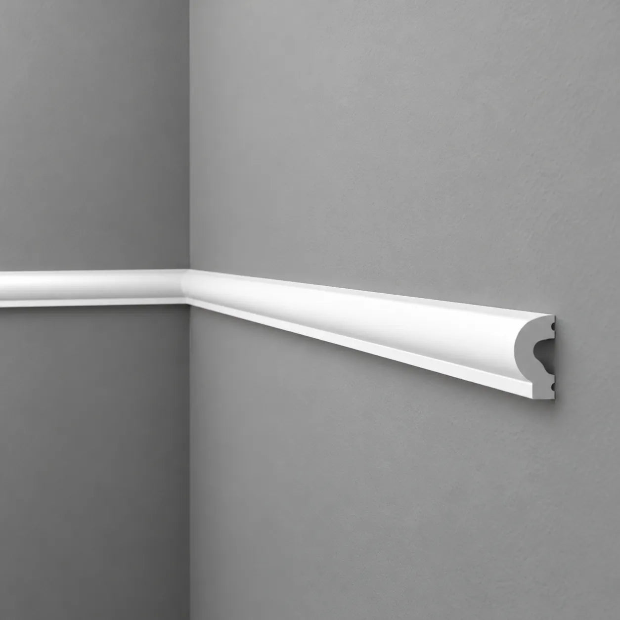 White WL13 WALLSTYL chair rail on grey walls, showing the corner joint and exposed profile end