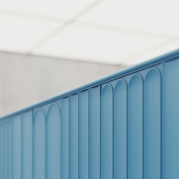 Close-up of blue WL13 WALLSTYL moulding finishing the top edge of decorative wall panels