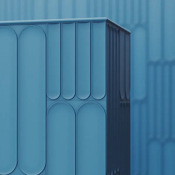 Blue WL13 WALLSTYL trim wrapping around the corner of a partition with rounded decorative panels