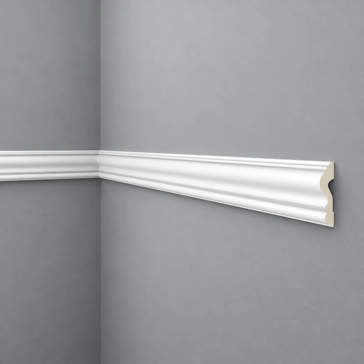 White Z1360 dado rail installed around a grey wall corner with a visible end profile