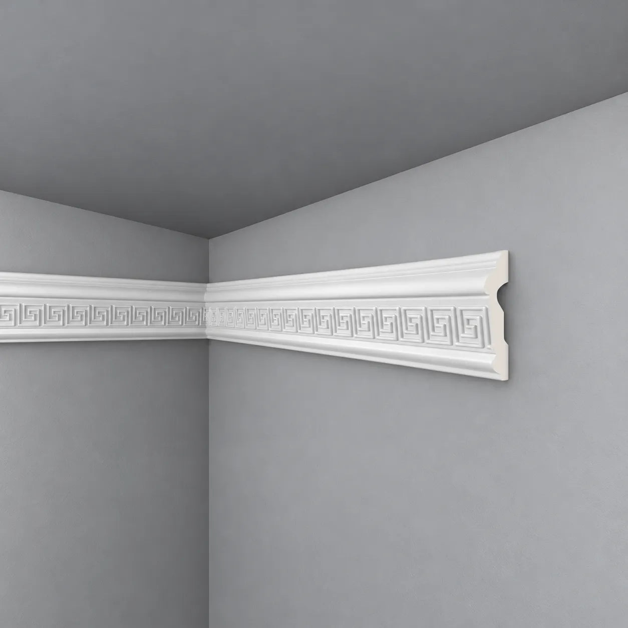 White Z31 dado rail with Greek key detailing and a visible end profile on a grey wall